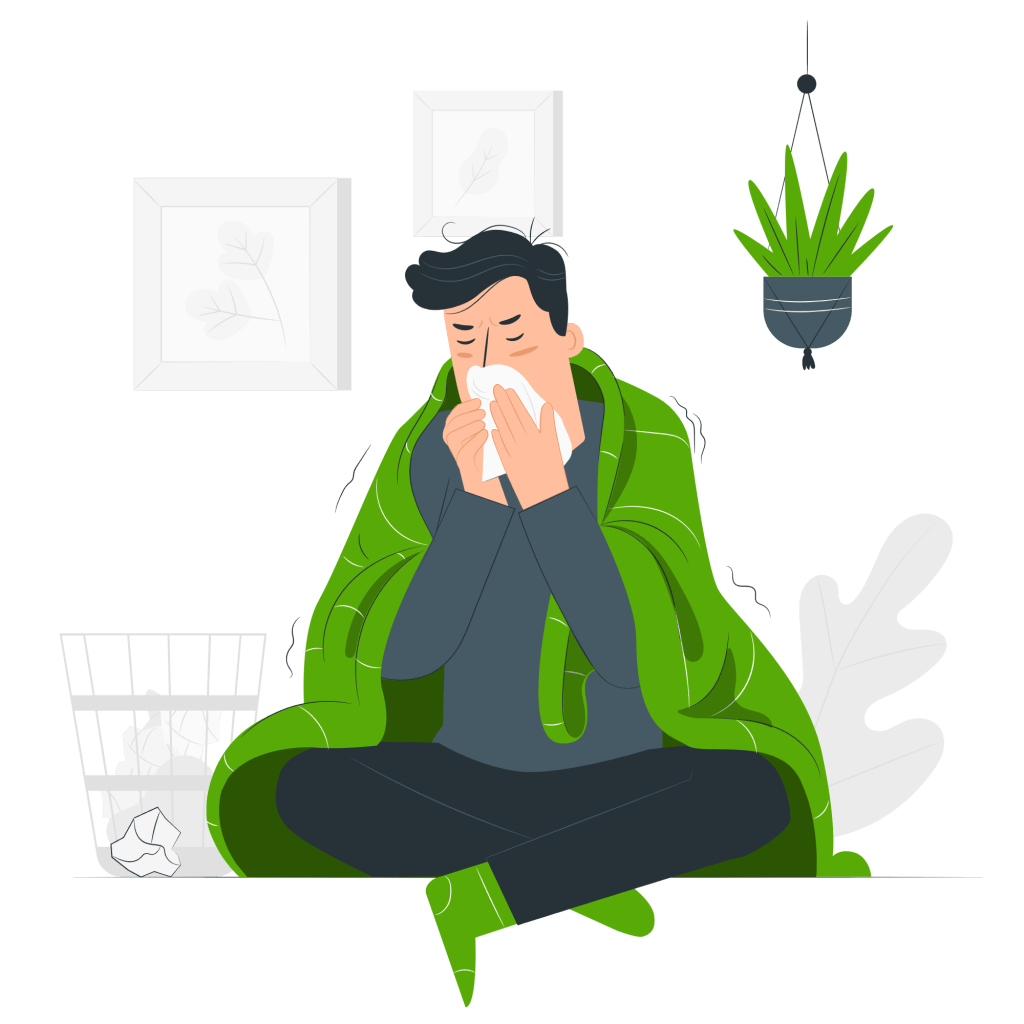 Man wrapped in a blanket, blowing his nose into a handkerchief, illustrating the importance of flu vaccination for winter protection.